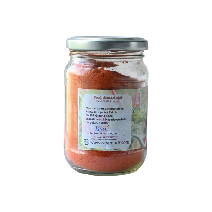Jar of red chili powder with a label on a white background
